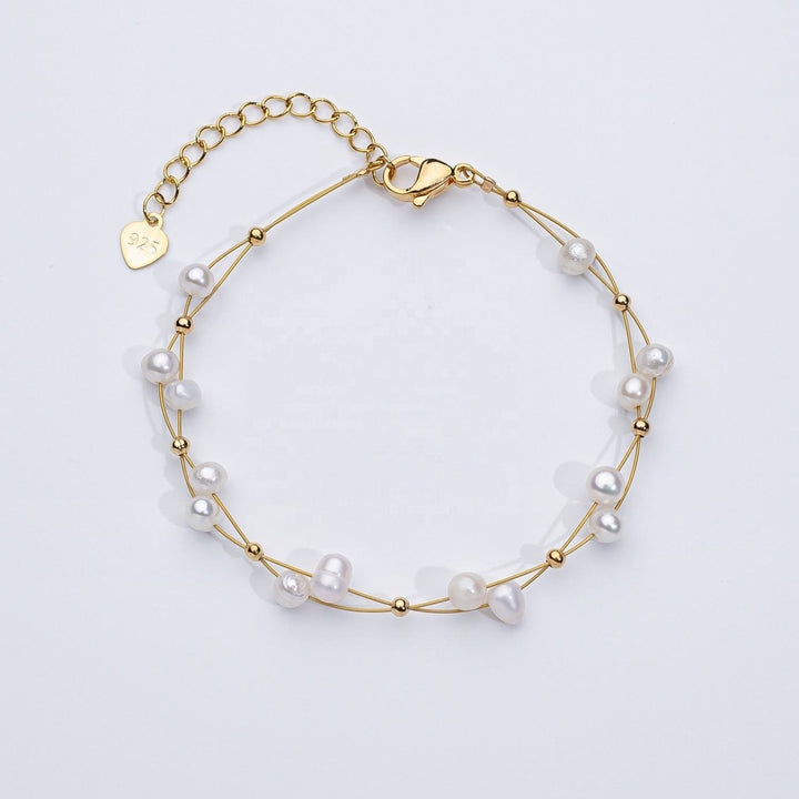 Pulsera tejida con perlas de agua dulce